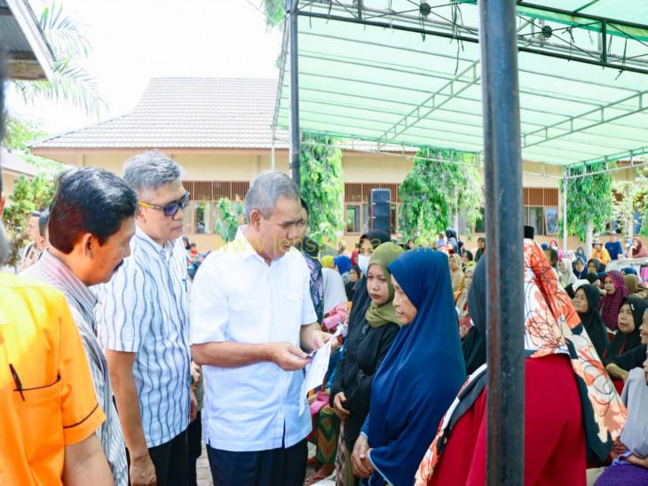 Pj Bupati Kampar Launching Perdana Program Penyaluran Beras KPM 2023.