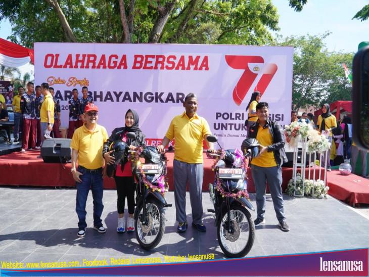  Gerak jalan Dan Senam Semarak HUT Bhayangkara Yang Ke-77 , Pj Bupati Kampar Serahkan Hadiah Utama Sepeda Motor. 